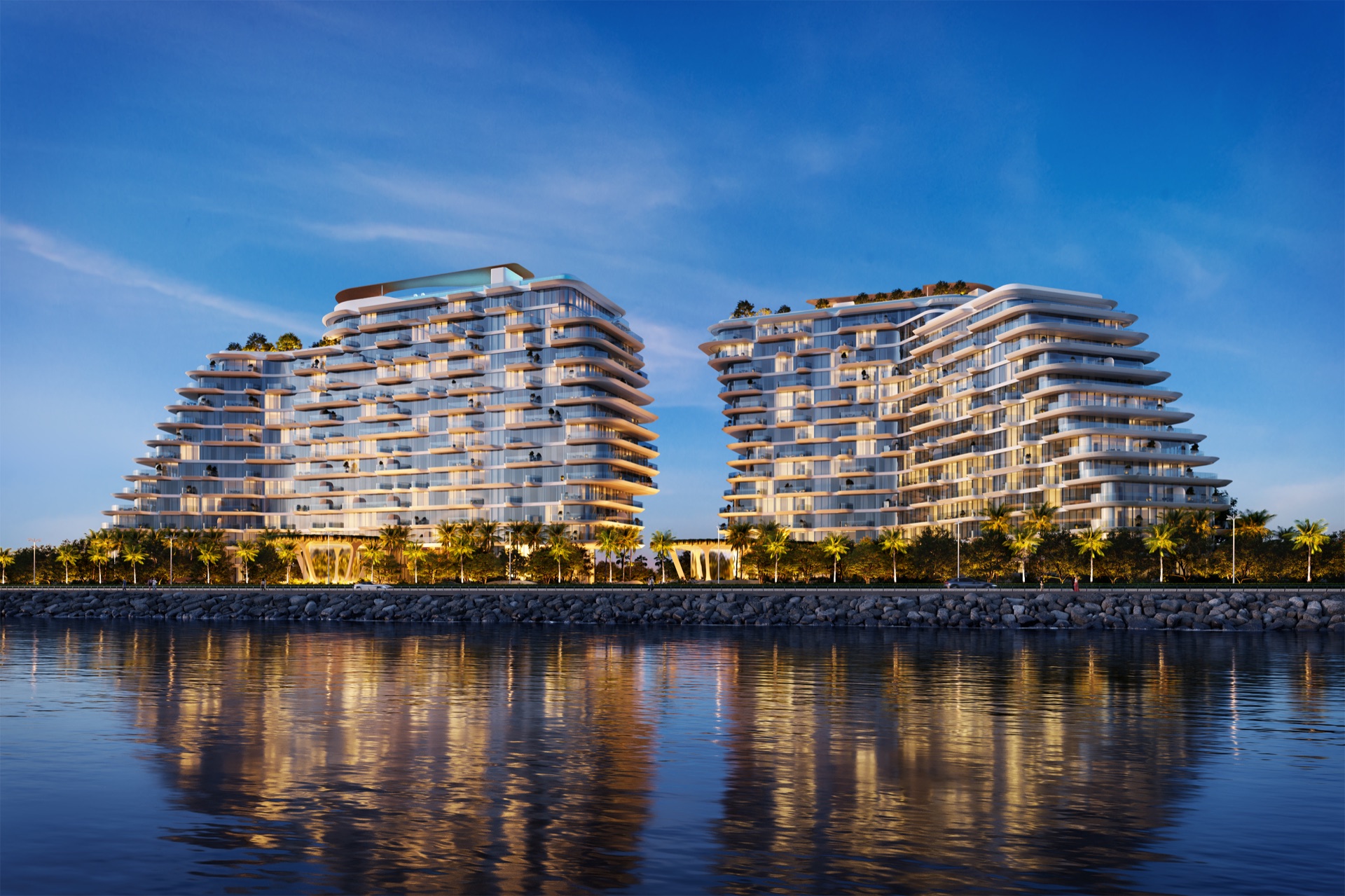 PASSO's two towers glowing over the water at night